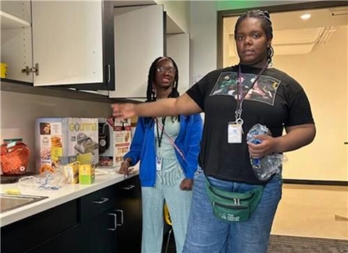 students in kitchen of food coop